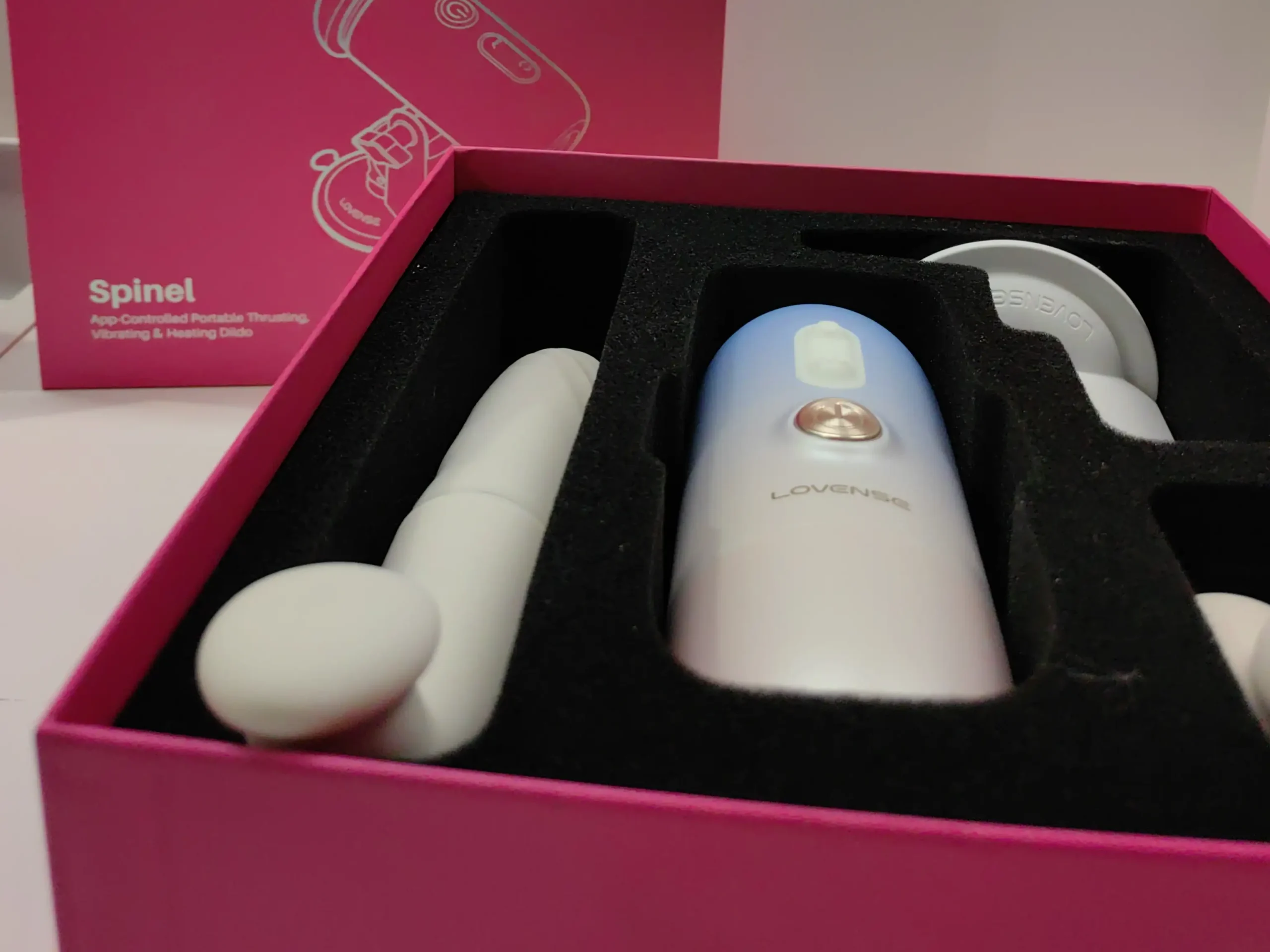 spinel dildo in its classy pink box with some attachments
