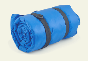 Rolled up sleeping bag which belt or towels wrapped around it