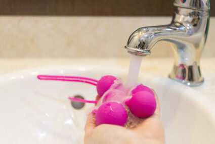 Rinsing love balls under tap