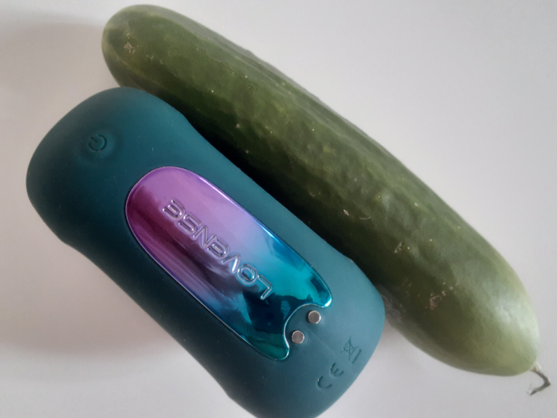My Lovense Gush 2 Motion lined up against a cucumber