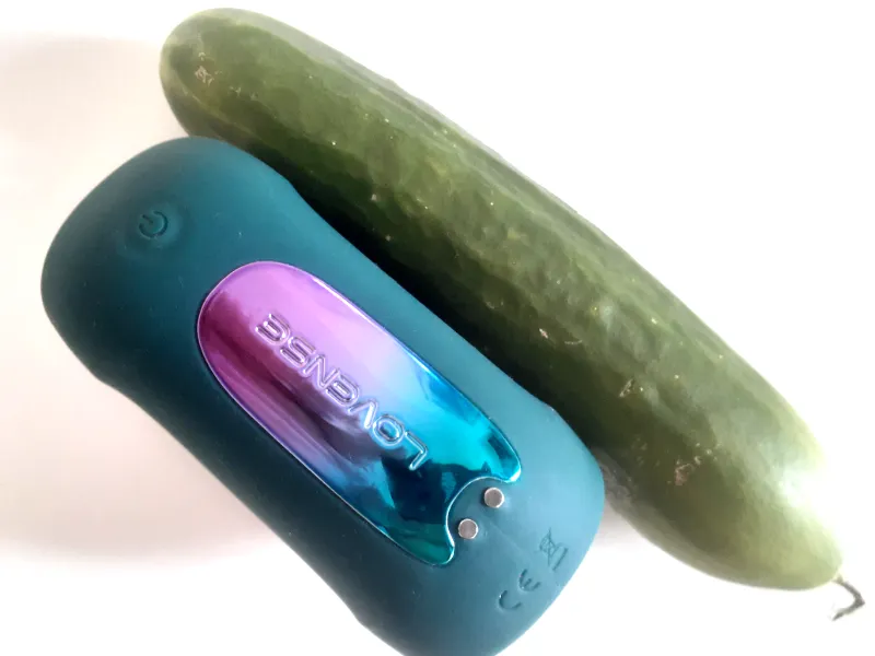 My Lovense Gush 2 Motion lined up against a cucumber