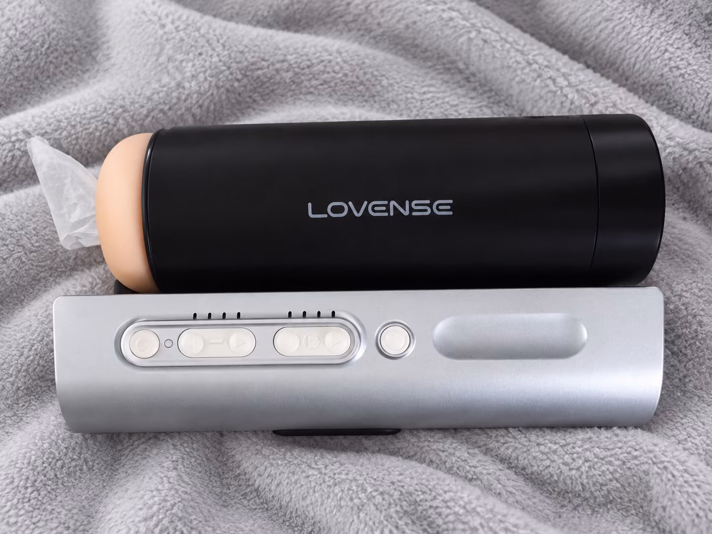 lovense Solace Pro on light grey blanket